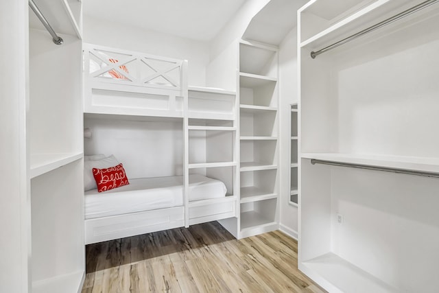 walk in closet featuring hardwood / wood-style floors