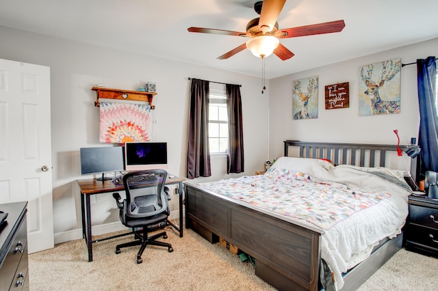 bedroom with baseboards and a ceiling fan