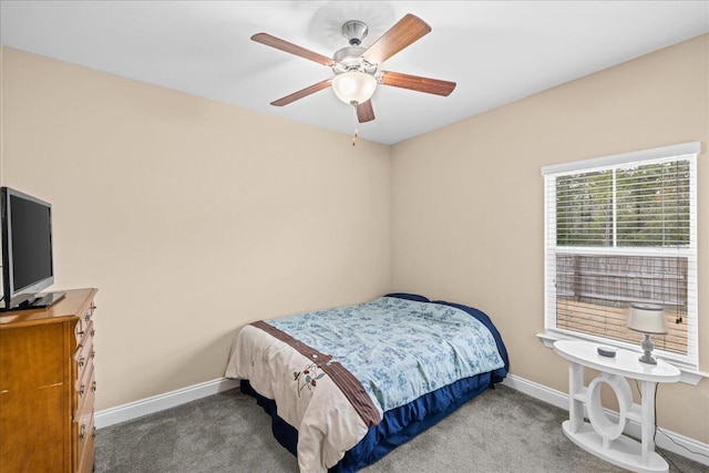 carpeted bedroom featuring a ceiling fan and baseboards