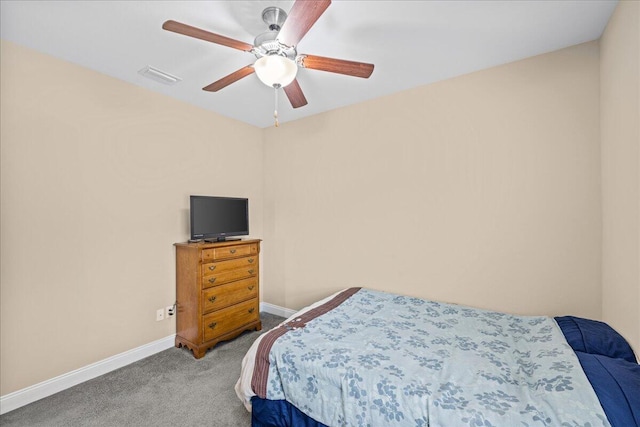 carpeted bedroom with baseboards, visible vents, and ceiling fan