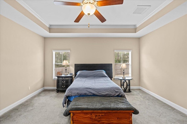 bedroom with baseboards, visible vents, a raised ceiling, and light colored carpet