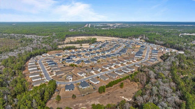 aerial view with a residential view and a wooded view