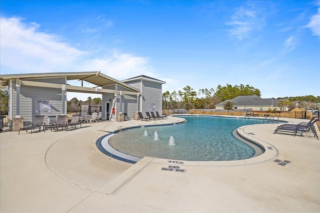 pool featuring a patio area and fence