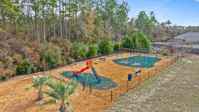 view of pool featuring playground community and fence