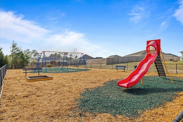 community jungle gym featuring fence