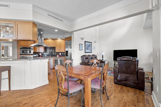 dining area featuring light hardwood / wood-style floors
