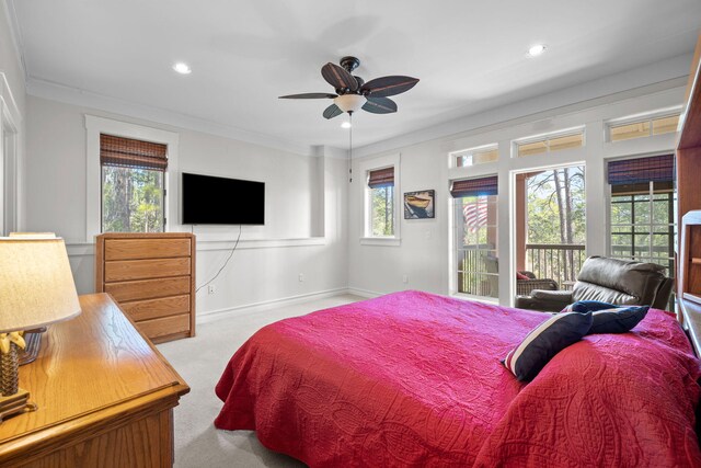 carpeted bedroom with crown molding, ceiling fan, and access to exterior