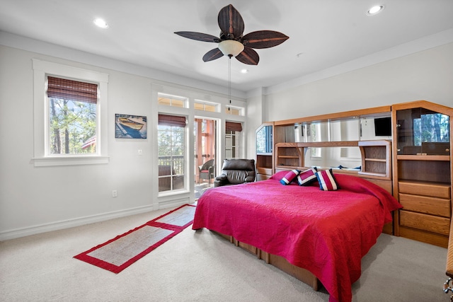 carpeted bedroom featuring access to outside and ceiling fan