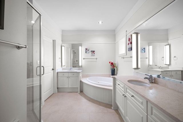 bathroom featuring crown molding, vanity, and shower with separate bathtub
