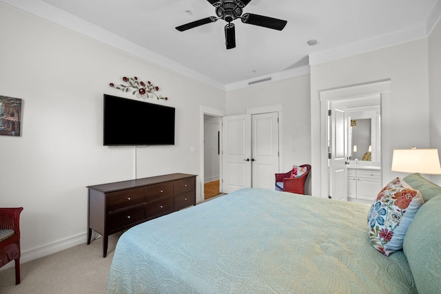 carpeted bedroom with crown molding, ceiling fan, and ensuite bath