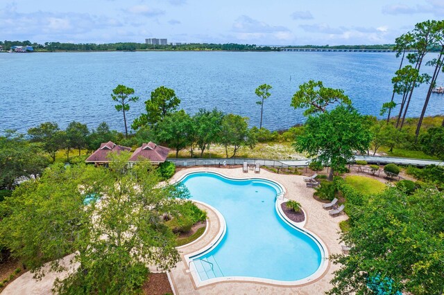 view of pool with a water view