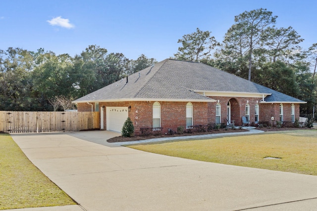 view of front of house featuring a garage and a front yard