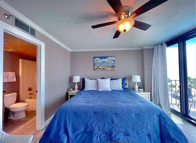 bedroom featuring hardwood / wood-style flooring, connected bathroom, ornamental molding, a textured ceiling, and access to outside