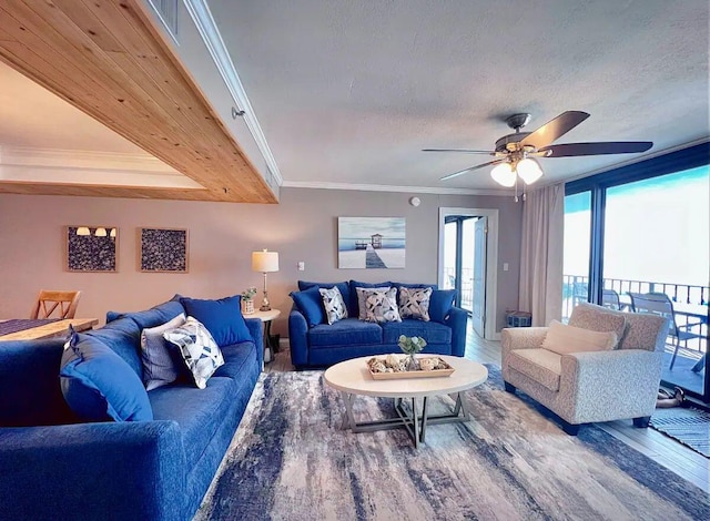 living room featuring crown molding, hardwood / wood-style floors, and a textured ceiling