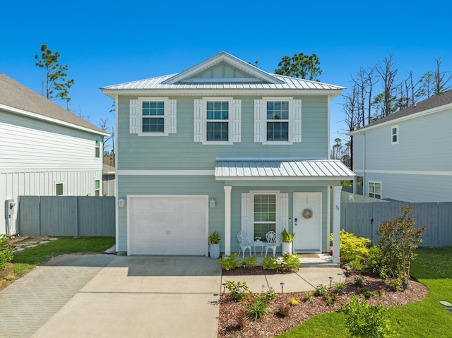 view of front of house with a porch and a garage