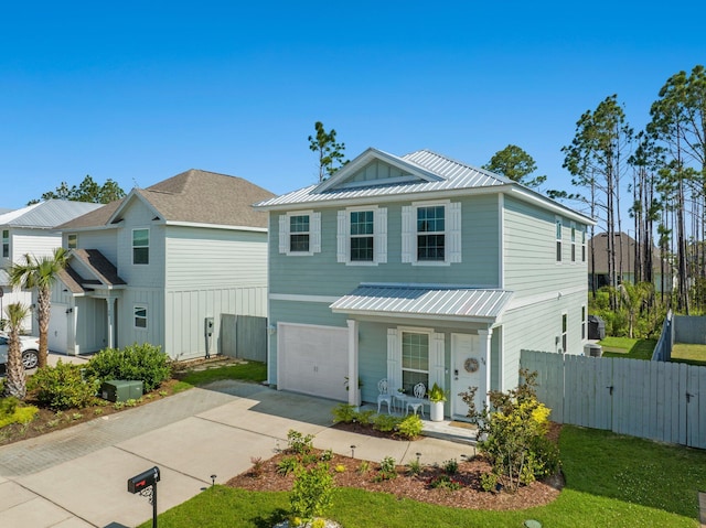 view of front of house with a garage and covered porch