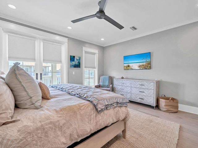 bedroom featuring light hardwood / wood-style flooring, ornamental molding, and ceiling fan