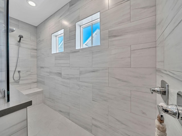 bathroom featuring a tile shower