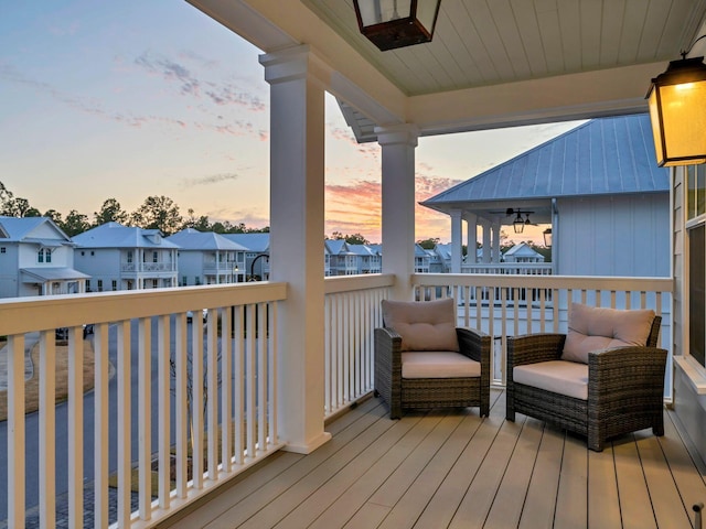 deck at dusk with ceiling fan