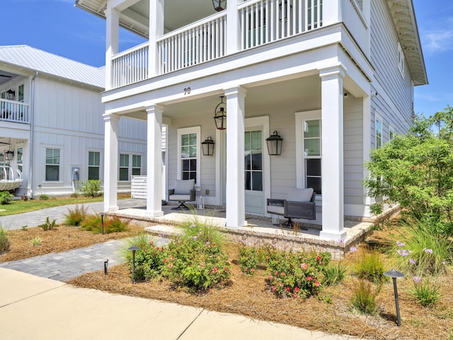 90 White Cottage Rd, Santa Rosa Beach, FL 32459 - doorway to property featuring a porch and a balcony