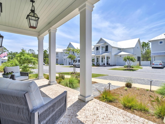 90 White Cottage Rd, Santa Rosa Beach, FL 32459 - view of patio / terrace with a residential view and covered porch