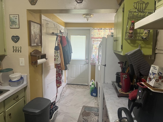 118 SE Carson Dr, Fort Walton Beach, FL 32548 - doorway to outside with light marble finish flooring and a textured ceiling