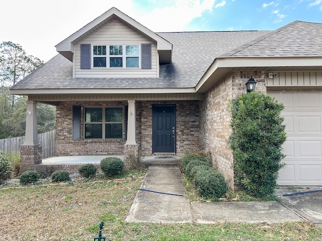 view of front of home with a garage and covered porch