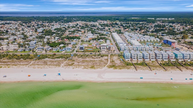 birds eye view of property featuring a water view and a view of the beach