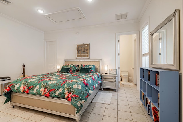 tiled bedroom featuring ornamental molding and ensuite bathroom