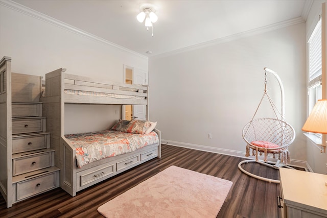 bedroom featuring crown molding and dark hardwood / wood-style floors