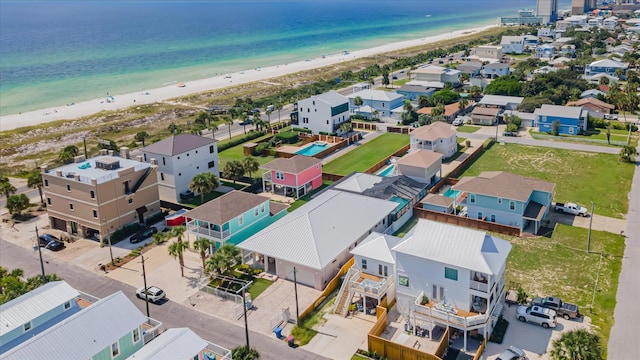 bird's eye view featuring a water view and a view of the beach