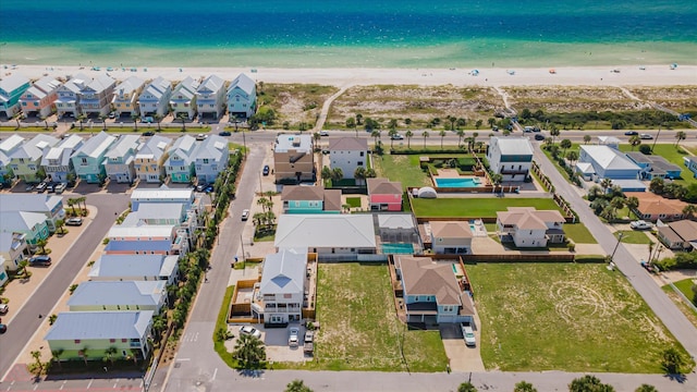 bird's eye view featuring a beach view and a water view