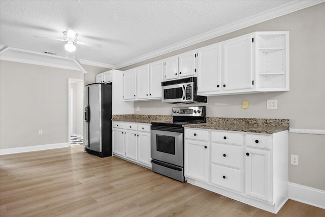 2185 Calle De Castelar, Navarre, FL 32566 - kitchen featuring stainless steel appliances, light wood-type flooring, and white cabinets