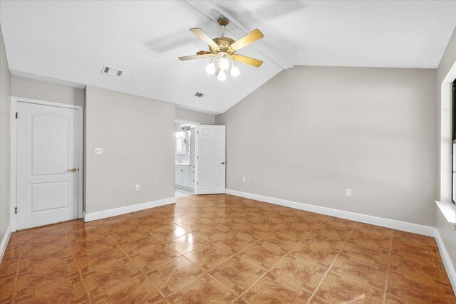 2185 Calle De Castelar, Navarre, FL 32566 - unfurnished room with ceiling fan, lofted ceiling with beams, and a textured ceiling
