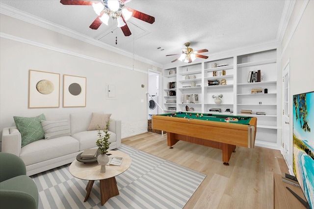 2185 Calle De Castelar, Navarre, FL 32566 - recreation room featuring stacked washer and dryer, pool table, crown molding, a textured ceiling, and light hardwood / wood-style flooring