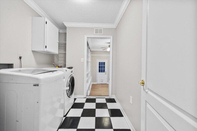 2185 Calle De Castelar, Navarre, FL 32566 - laundry room featuring crown molding, cabinets, a textured ceiling, ceiling fan, and independent washer and dryer