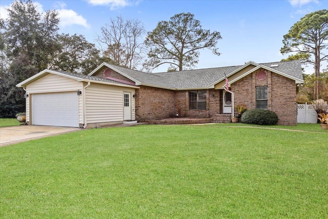 ranch-style house featuring a garage and a front yard