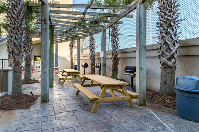 view of patio featuring a grill and a pergola