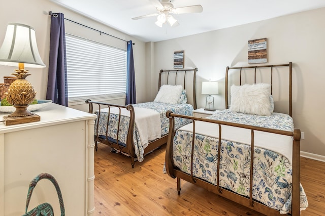 bedroom with ceiling fan and light wood-type flooring