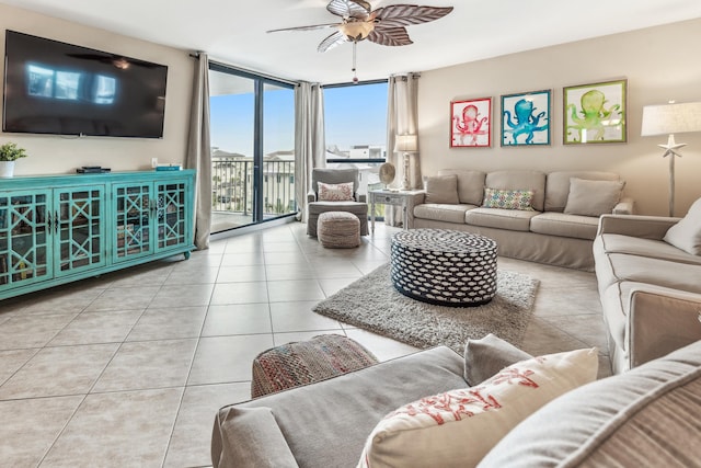 living room featuring light tile patterned floors, floor to ceiling windows, and ceiling fan