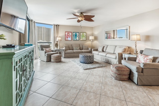 tiled living room featuring ceiling fan