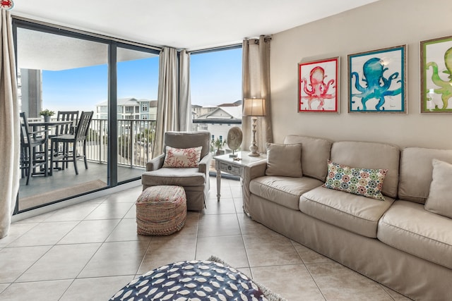 tiled living room featuring expansive windows