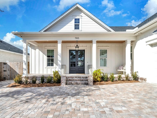 property entrance featuring french doors