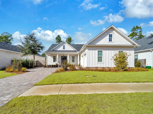 view of front of house with a front lawn and a porch