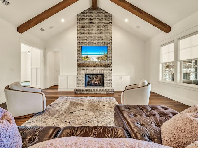 living room featuring dark wood-type flooring, a fireplace, and lofted ceiling with beams