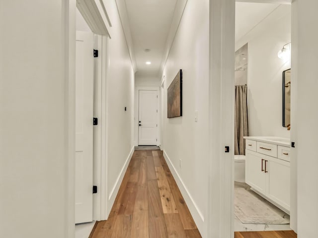 corridor featuring light hardwood / wood-style flooring