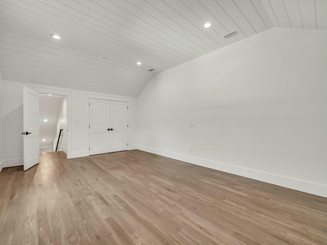 interior space with vaulted ceiling, light hardwood / wood-style floors, and wooden ceiling