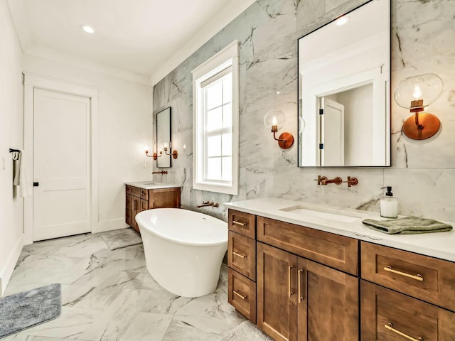 bathroom with vanity, a tub, tile walls, and crown molding