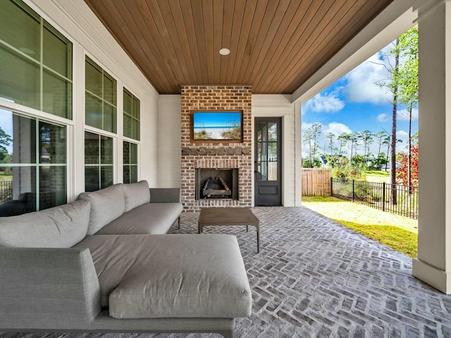 view of patio / terrace featuring an outdoor brick fireplace