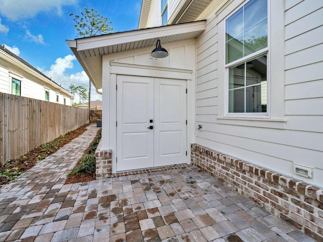 entrance to property with a patio area